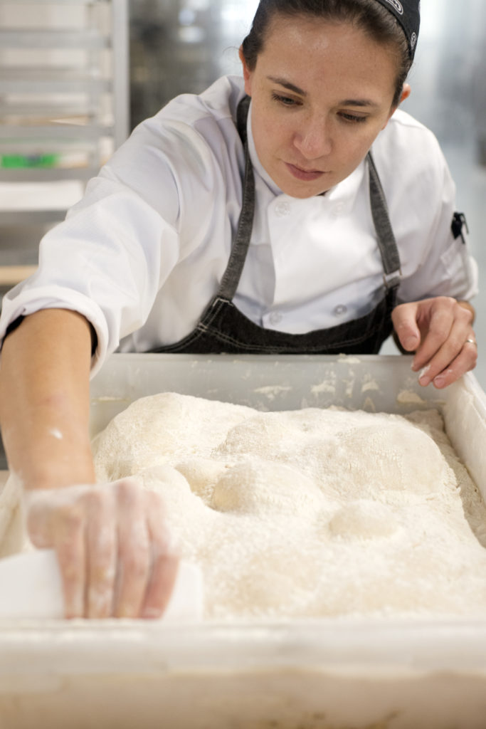 Baker preparing dough in the kitchen