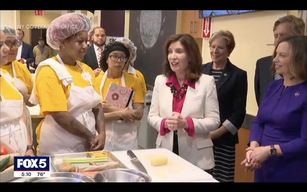 Governor Hochul speaking to Hot Bread Kitchen members alongside CEO Leslie Abbey.