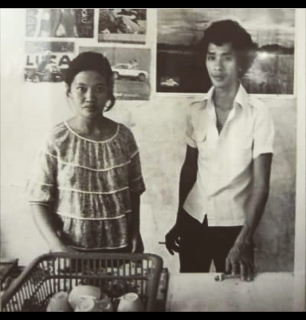 Photo of Diana's parents at their coffee cart in Thailand