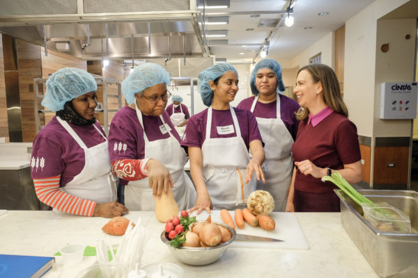 Hot Bread Kitchen students in the kitchen with the CEO